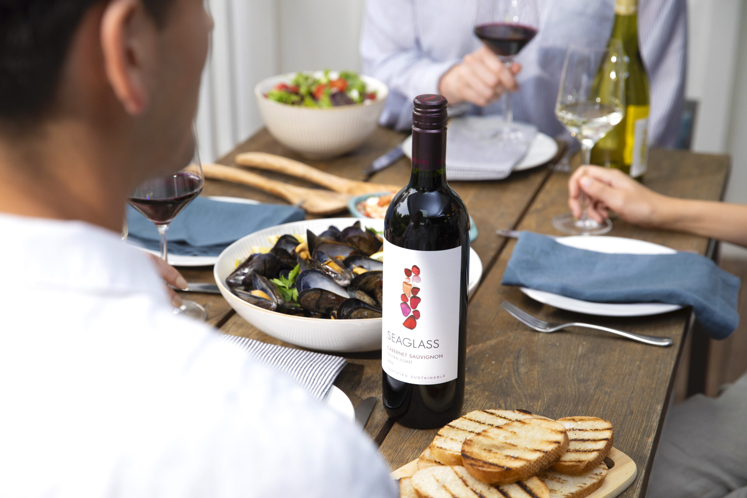 SEAGLASS Cabernet Sauvignon bottle on table with mussels